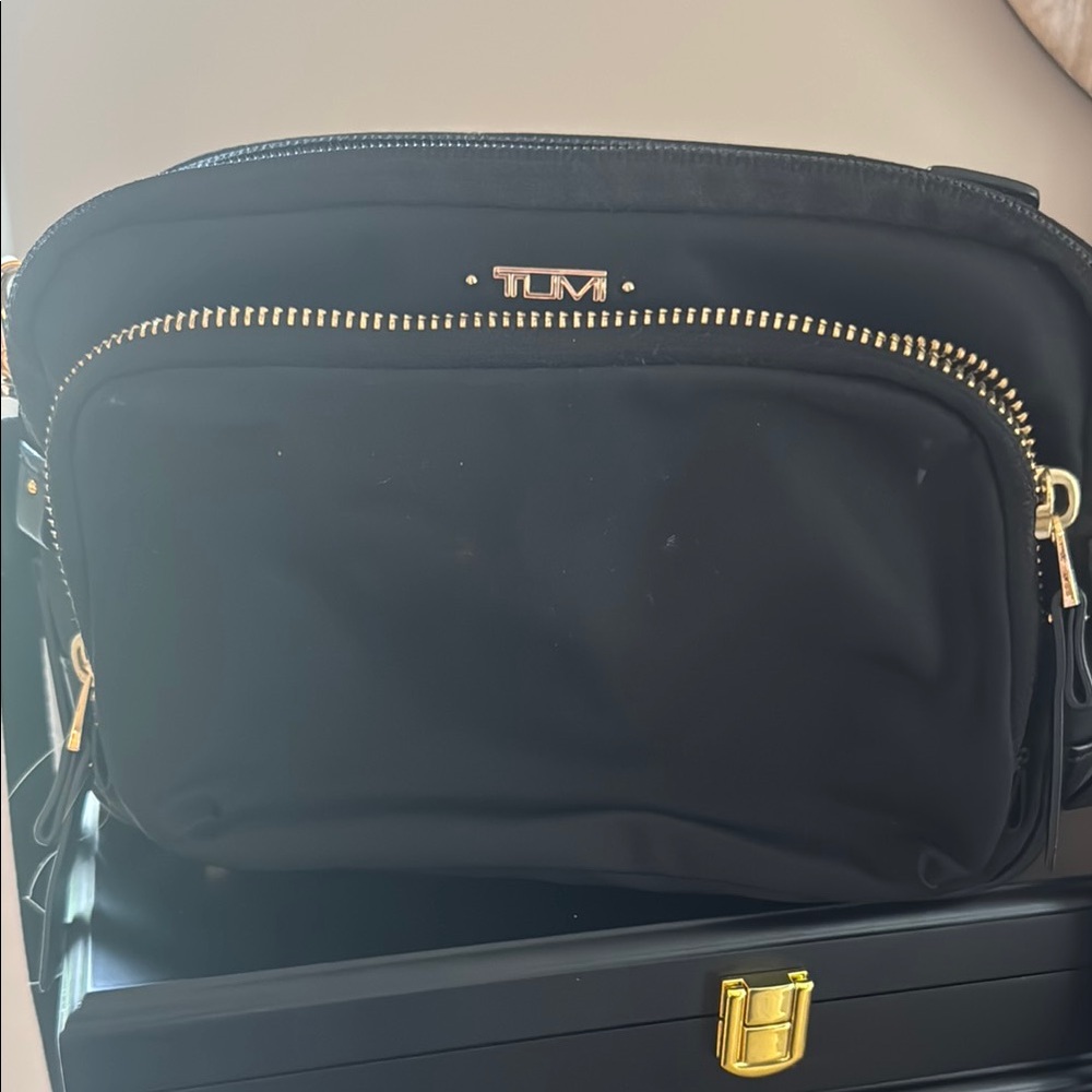 Tumi Black crossbody Bag with gold Detailing